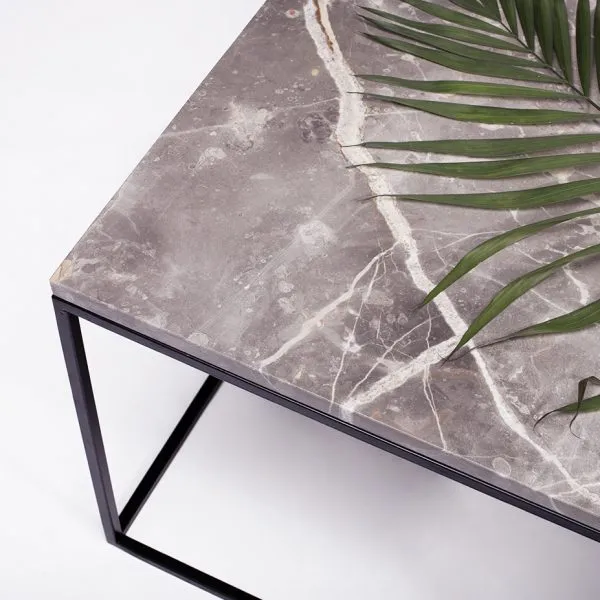 The Moon coffee table, a grey marble top on a black metal frame